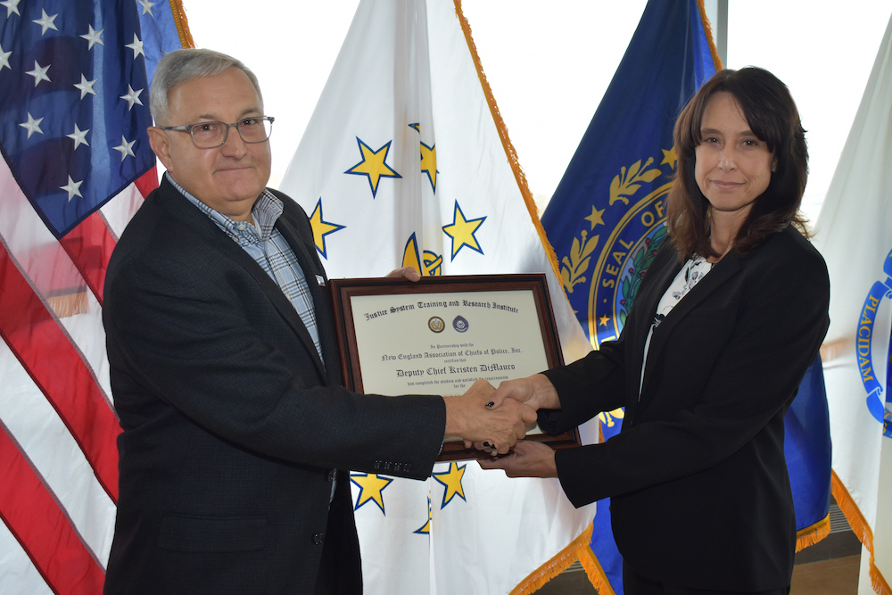 Mashantucket Pequot Tribal Nation Deputy Chief Kristen DiMauro receives her certification plaque after completing Roger Williams University's executive leadership program. (Courtesy photo)