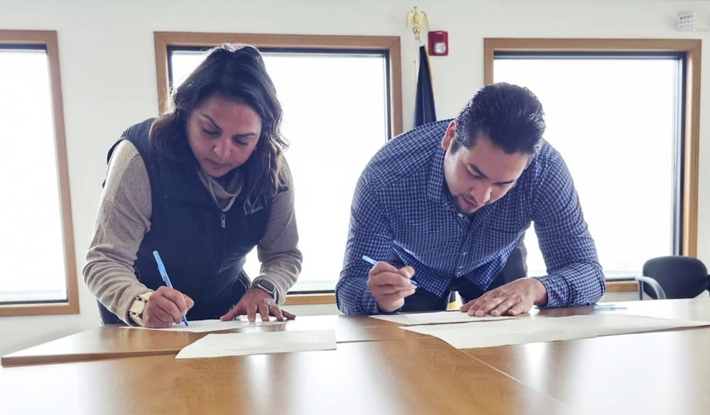 Iḷisaġvik College President Justina Wilhelm and ACSPI Tribal President John Melovidov signed the MOA on July 27, 2024 to begin development of a satellite campus. (Courtesy photo) 