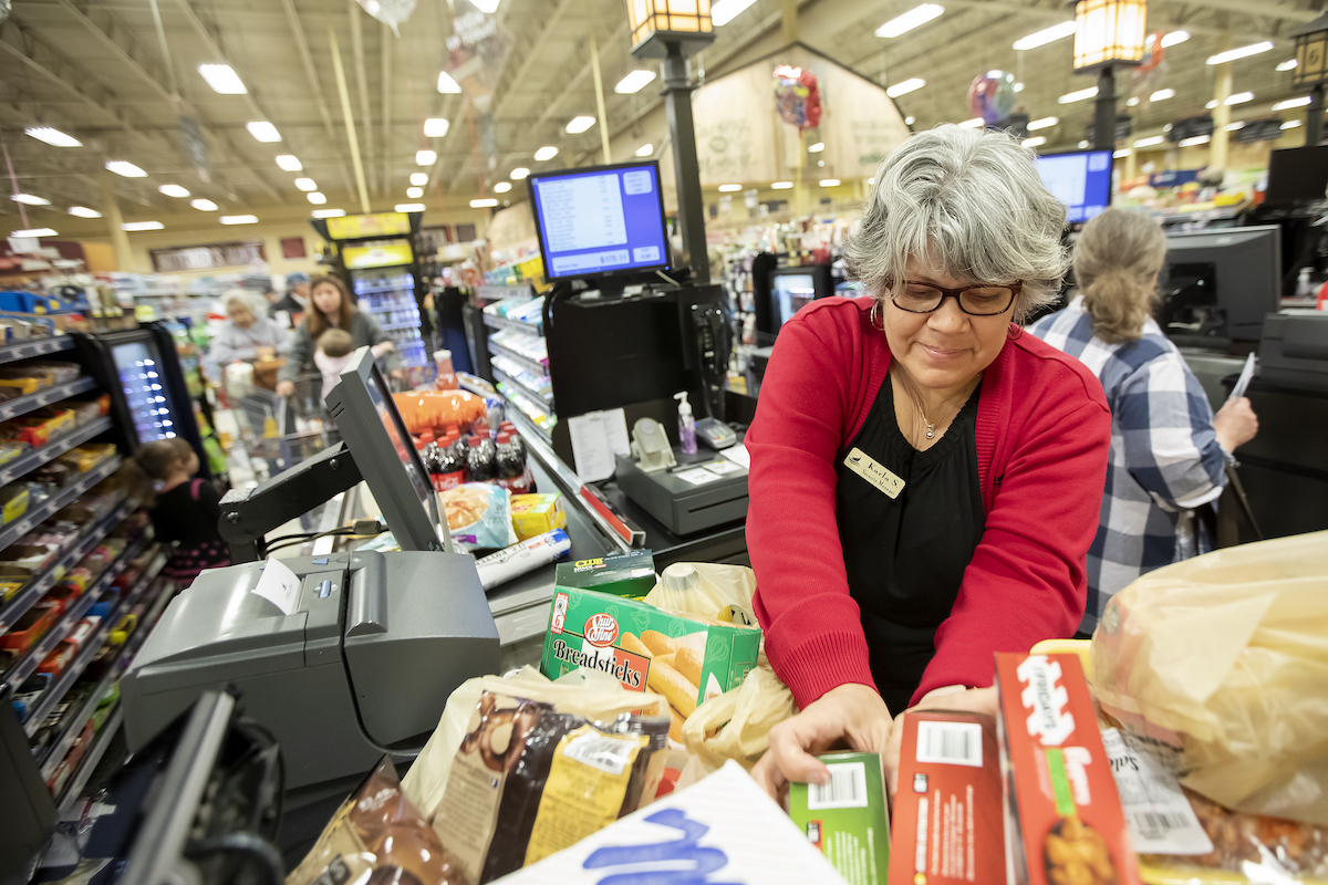 Karla Sample, security manager, bags groceries at FireLake Discount Foods in Shawnee, Okla., Thursday, Jan. 17, 2019. 